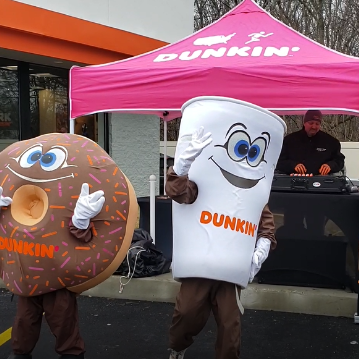 DJ James rock at a grand opening of Dunkin store with the Dunkin Mascots at Bear De