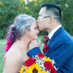 Jimmy kissing Renee forehead outside the wedding.